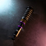 Coilover suspension part laying on concrete floor purple elements
